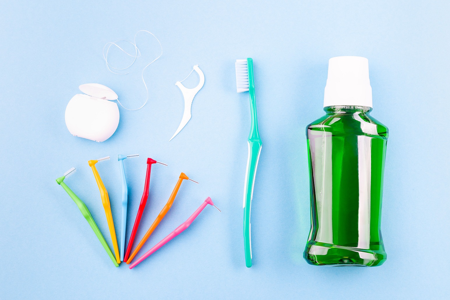 Dental hygiene items on colorful background