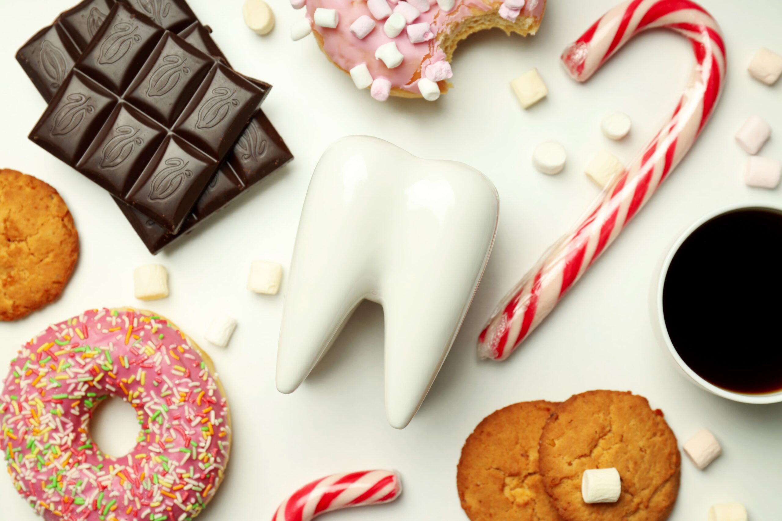 Tooth surrounded by candy and sweets