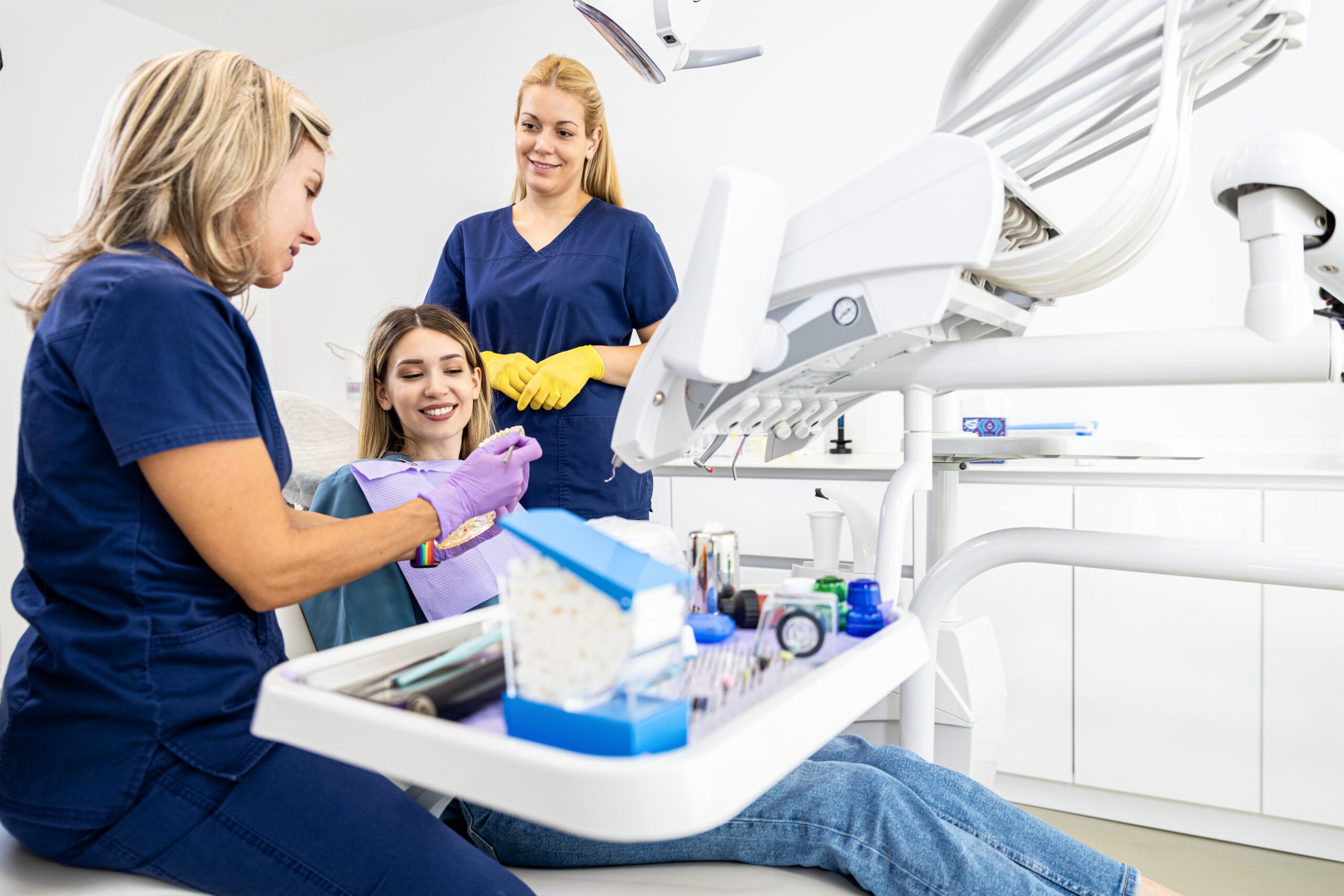 Dentist and assistant performing treatment on a patient