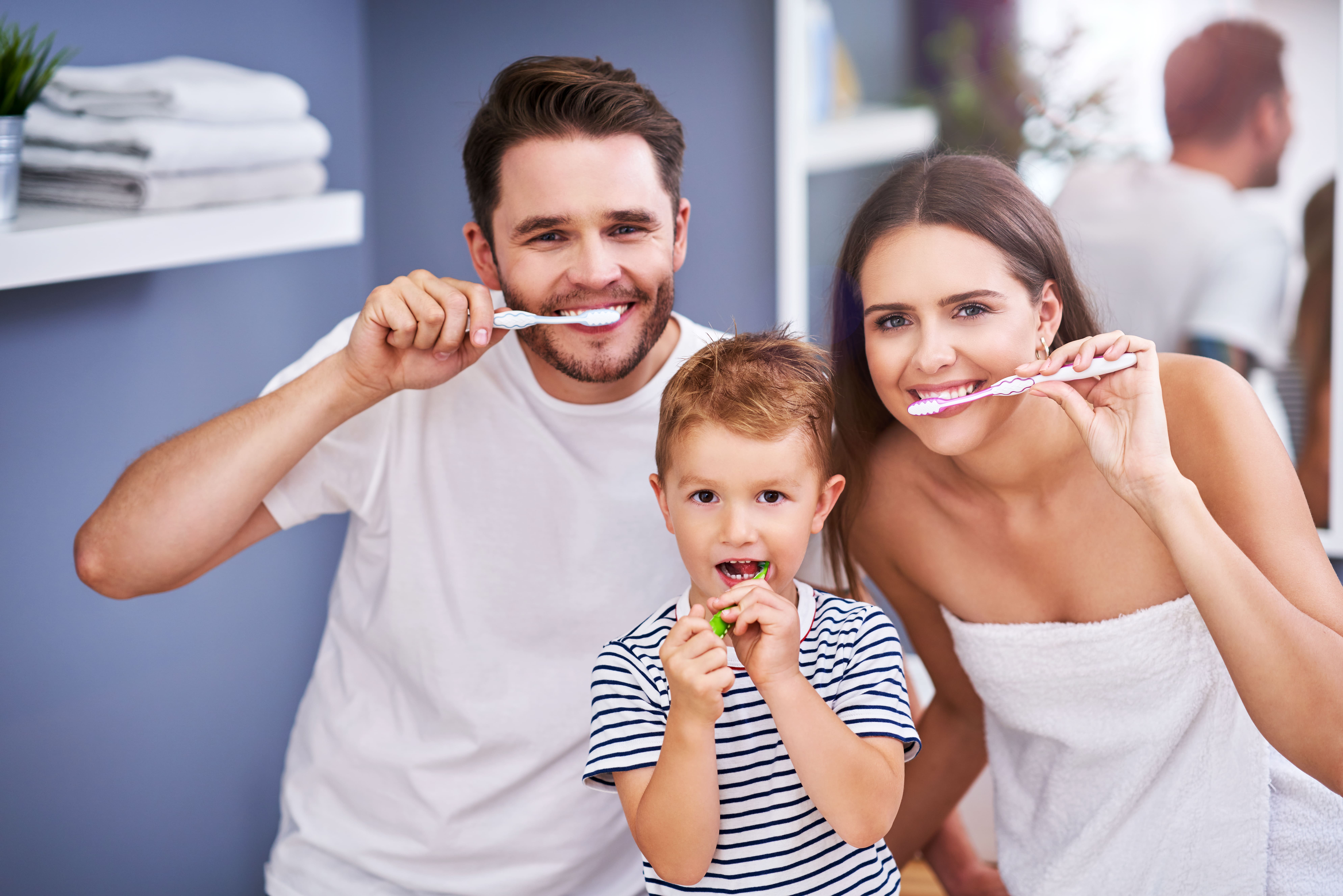Family brushing teeth